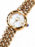 Scottie Oro mother-of-pearl dial and faceted gold bezel, close-up